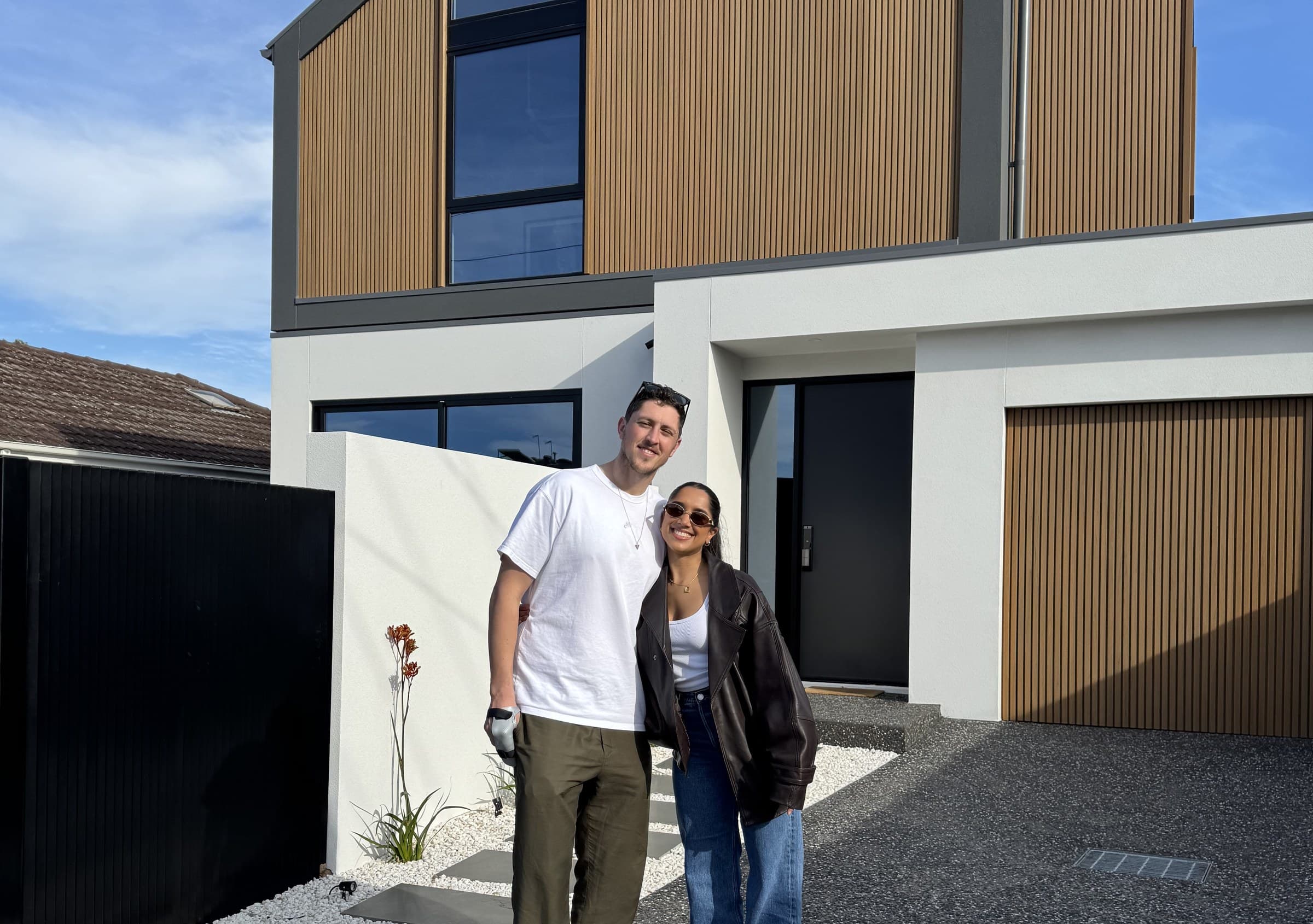 Nicole and Alex outside their new home